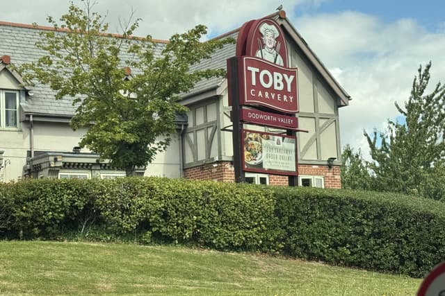 SophieMeiLan's tweet card. On a busy roundabout just off the M62, Toby Carvery stands in pride of place, mounted like a castle on a hill.