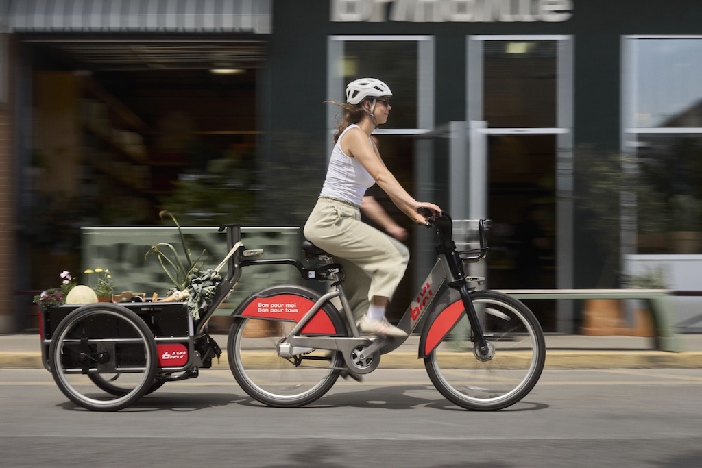 MomentumMag's tweet card. As of this summer, 50 purpose-built BIXI trailers—designed and assembled entirely in Montreal, are available as part of the city's bike share