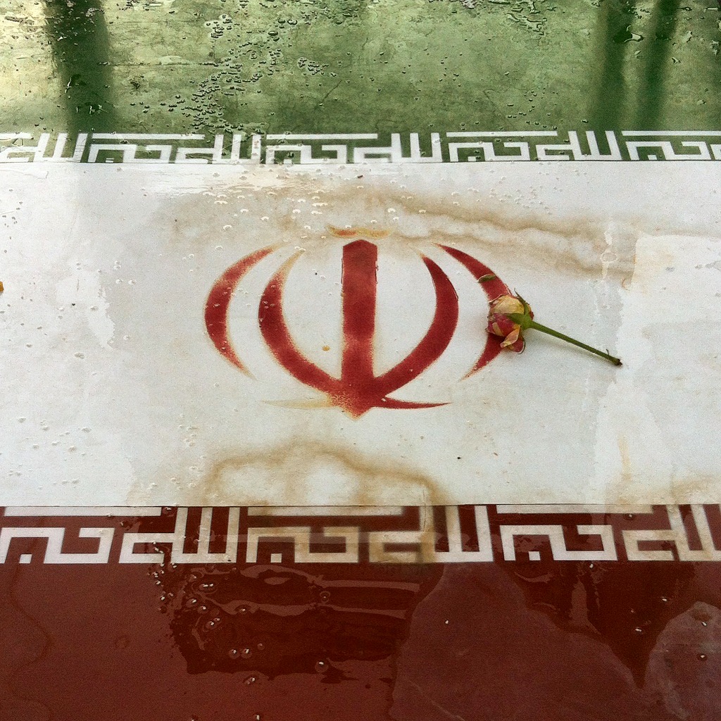 AjamMC's tweet card. After Iran's 1979 Revolution, an open call was launched for a new national emblem and flag. Kimia Maleki explores the history of Iran's flag and the meaning of the emblem based on an interview with...