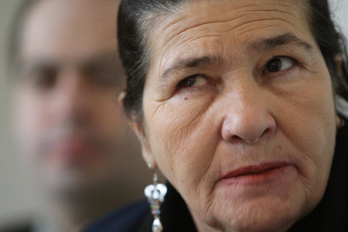 mikecmorgan's tweet card. Maria de Menezes, 80, thanks Londoners for unwavering support on 20th anniversary of his death at Stockwell Tube station