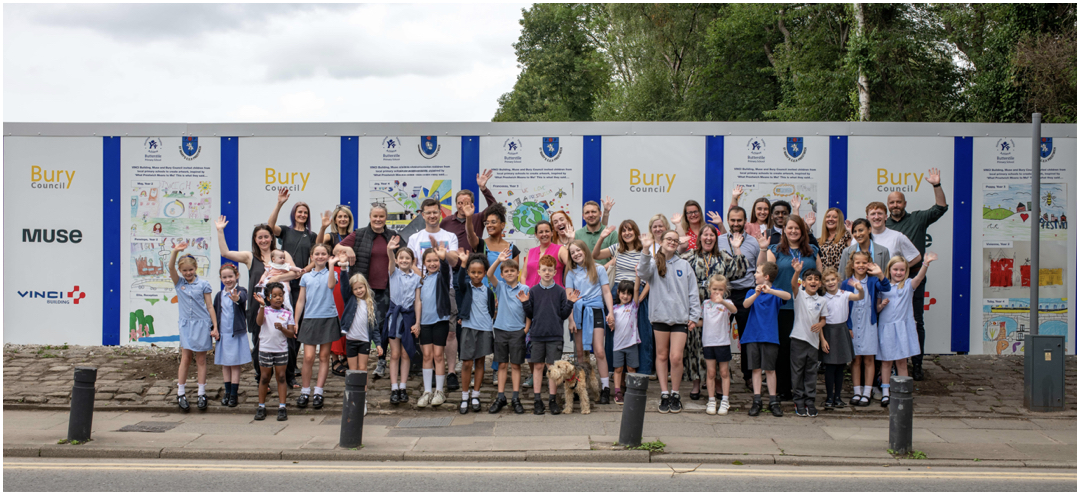 AboutMcr's tweet card. Local schools in Prestwich have created some eye-catching designs for the hoardings surrounding the site for the new Prestwich Travel Hub – the first