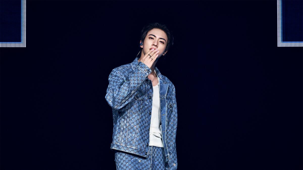 latimes's tweet card. The eldest member of the megastar K-pop group took the stage to deafening screams at the stadium in Anaheim, delivering a wide swath of solo hits and BTS favorites during his two-night run.