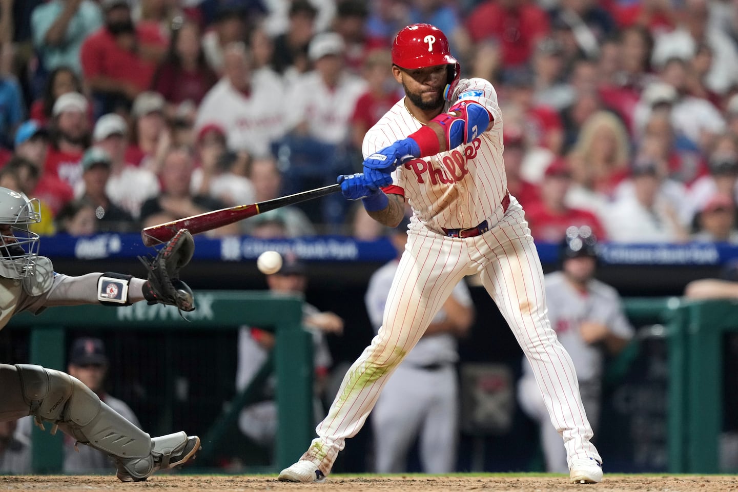 BostonGlobe's tweet card. With the bases loaded in the bottom of the 10th, Phillies hitter Edmundo Sosa's bat nicked Carlos Narvaez's glove on a check swing, and one replay review later the game was over.