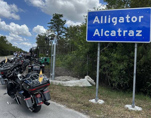 americamag's tweet card. Archbishop Wenski of Miami and some 25 Knights of Columbus saddled up their motorcycles to pray a rosary at the entrance of Alligator Alcatraz, the migrant detention center recently opened in the...