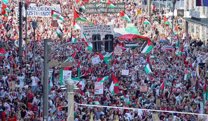 redflag_soc's tweet card. The centre of Berlin was a sea of Palestinian flags and keffiyehs on Saturday 21 June. Banned slogans were held aloft and chanted loud. At least 50,000 turned out to show solidarity with Gaza.