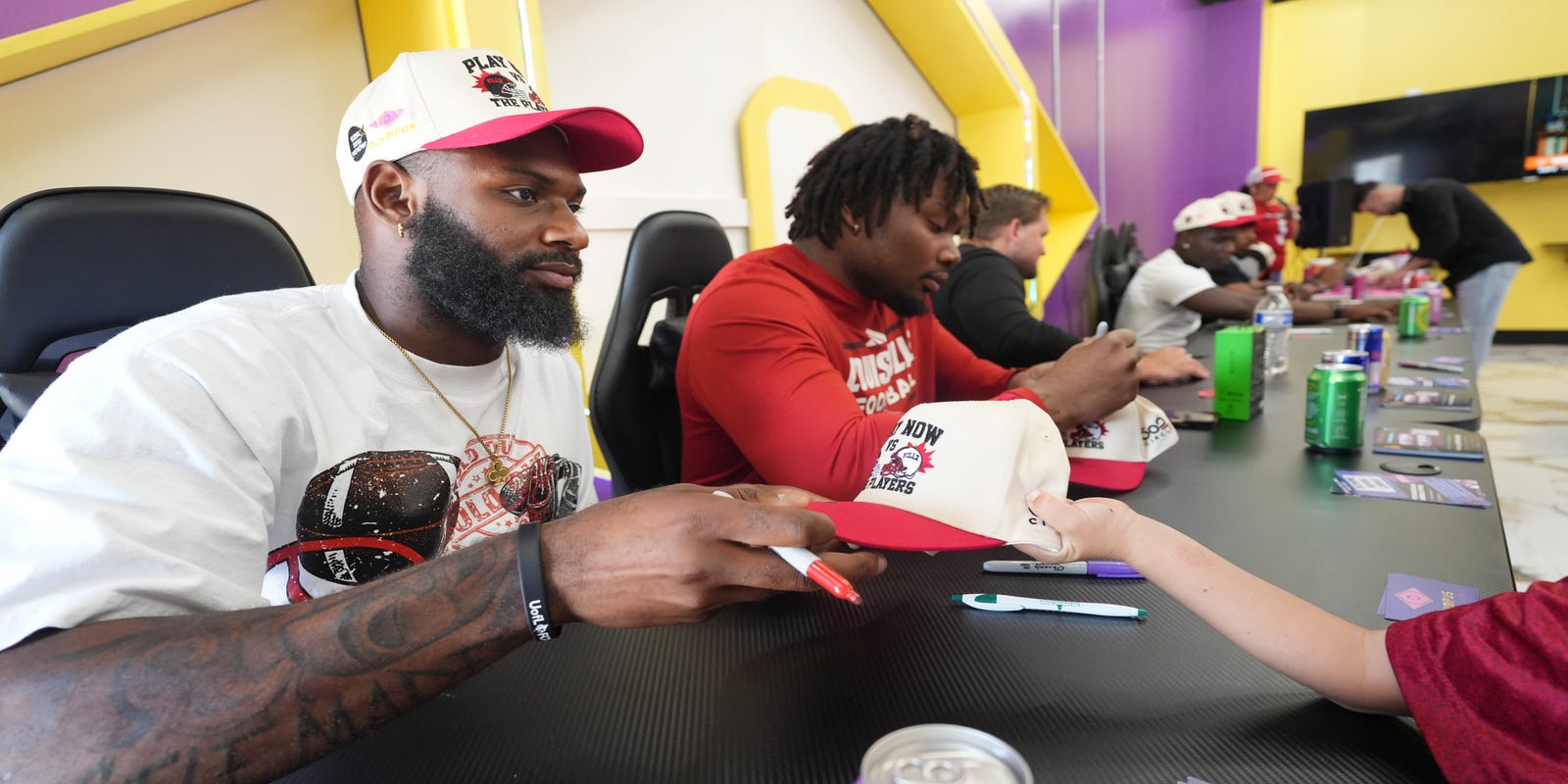 CardsHQ_CJ's tweet card. Rodney Johnson used to work double shifts after playing football. Now at Louisville, he's able to earn money from the new revenue-sharing deal.