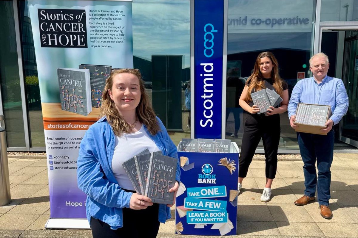 dumbartonreport's tweet card. Scotmid donates cancer support books to Renton and Alexandria Book Banks, aiding communities with Stories of Cancer and Hope.