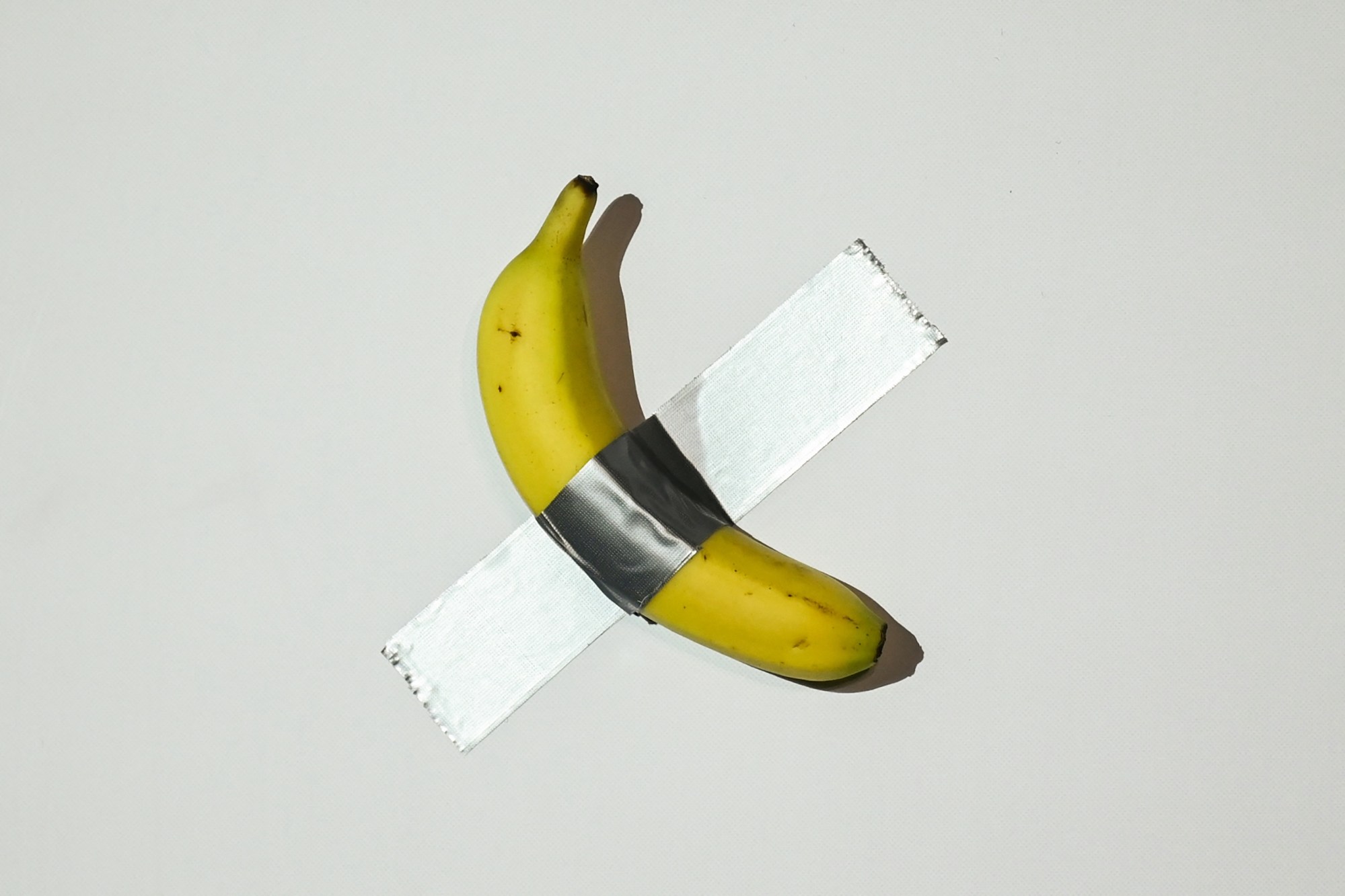 artnews's tweet card. The duct-taped fruit from the conceptual artwork was on display at the Centre Pompidou-Metz in a major show curated by the artist.
