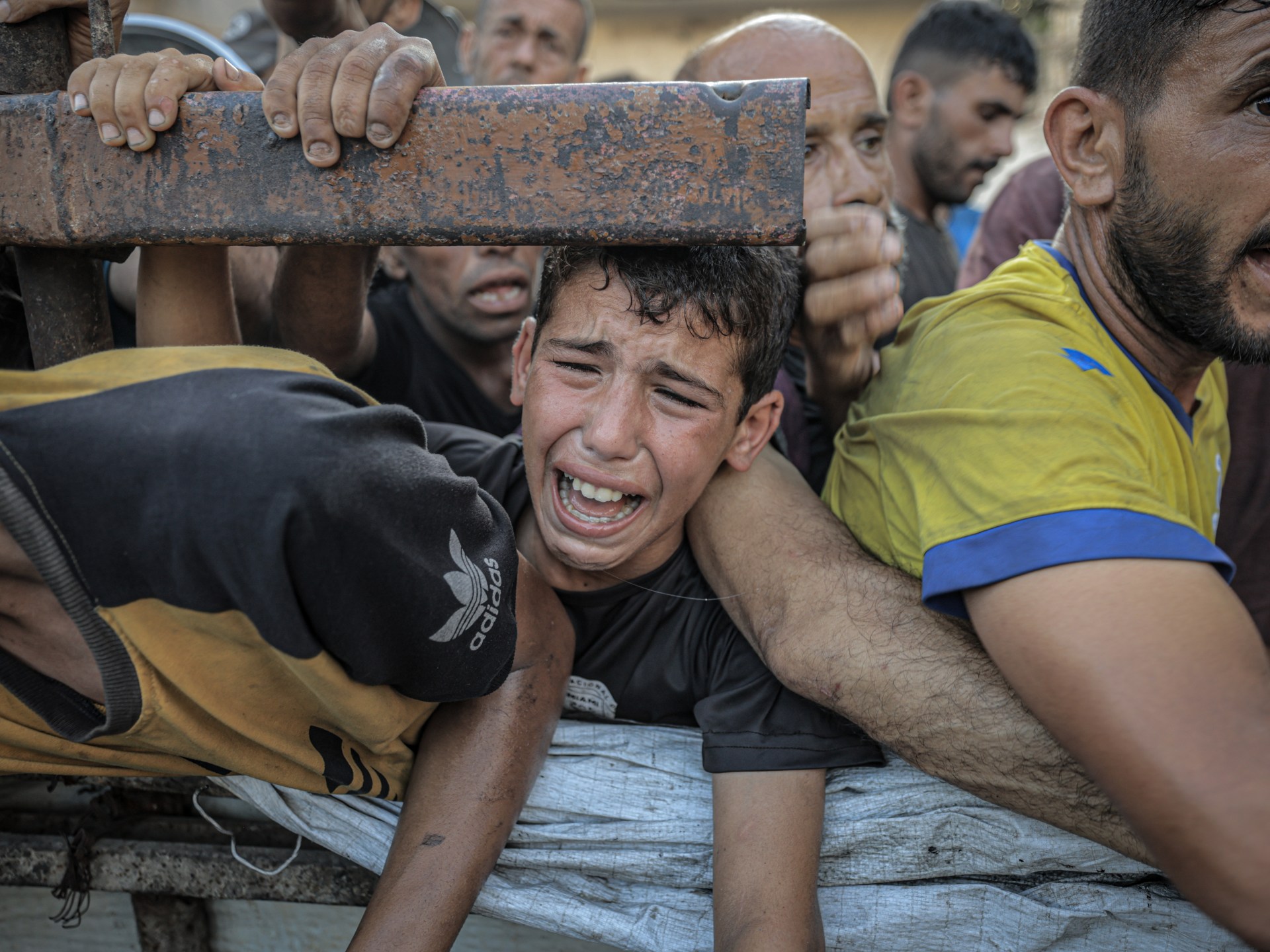 Save_GlobalNews's tweet card. UN says workers are fainting from hunger and exhaustion as Israel’s restriction of aid deepens an already dire crisis.