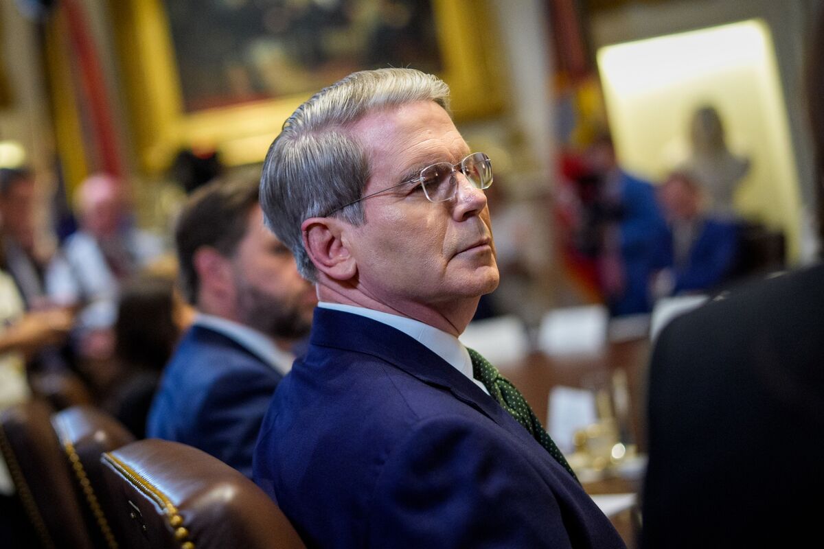 DanielPFlatley's tweet card. US Treasury Secretary Scott Bessent suggested that Federal Reserve Chair Jerome Powell should step down from the central bank’s board when his term as chair is up in May 2026.