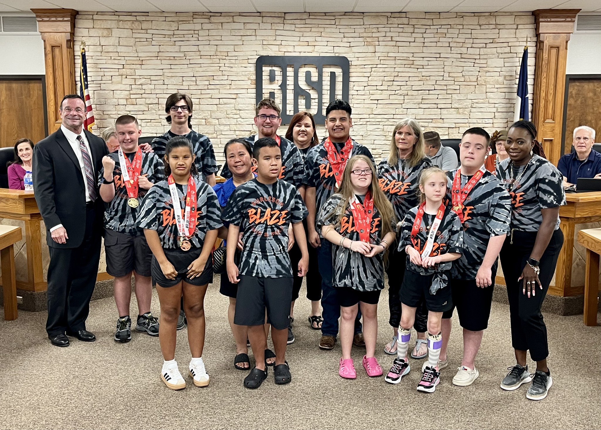FortWorthReport's tweet card. Special Olympians, track and field standouts, and art students were among those the Burleson ISD board recognized.