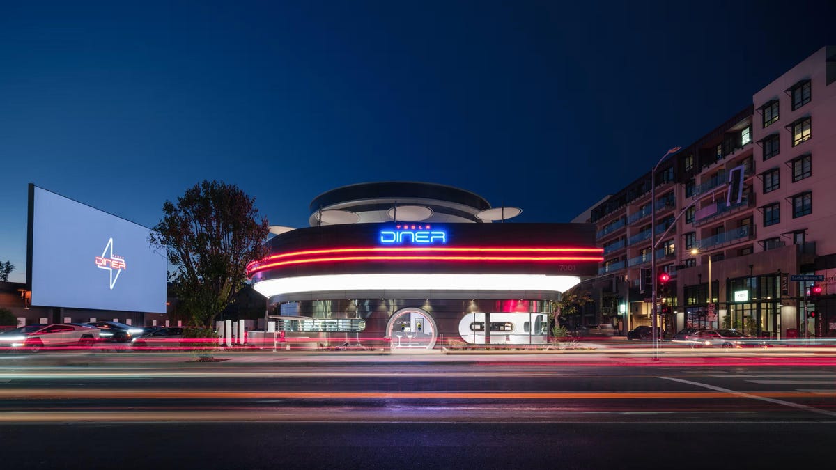 CNET's tweet card. The tech giant opens a retro restaurant in Hollywood with charging stations. Musk says more could open in other cities.