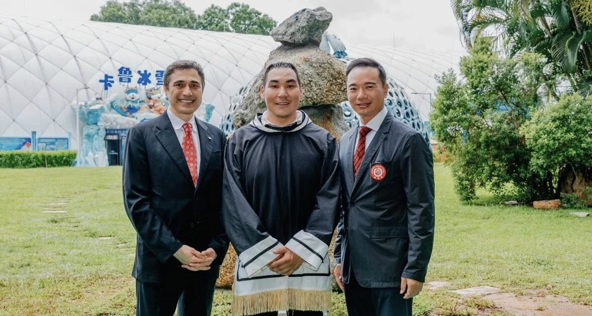 NunatsiaqNews's tweet card. A 2.7-metre stone inuksuk made by Kinngait sculptor Koomuatuk Curley was unveiled in China on Canada Day.