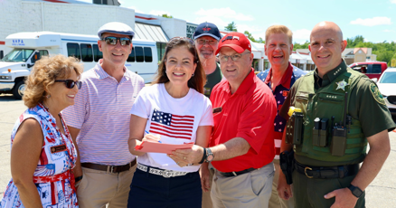 JBartlett_NH's tweet card. Gov. Kelly Ayotte signed groundbreaking legislation on Independence Day that will let cities and towns create “social districts” that let patrons buy alcohol and take it with them to designated