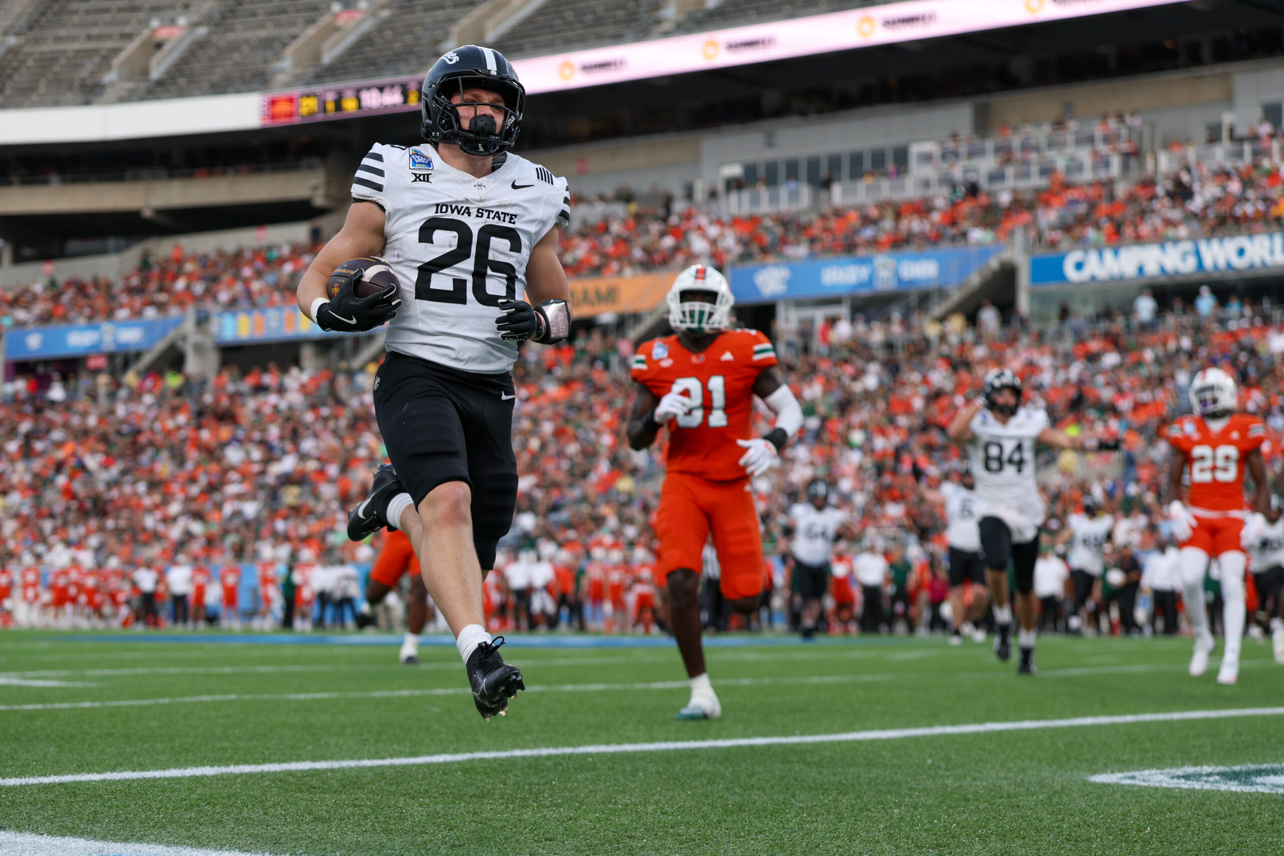 LSHSCougarsFB's tweet card. Dec 28, 2024; Orlando, FL, USA; Iowa State Cyclones running back Carson Hansen (26) scores a touchdown against the Miami Hurricanes in the second quarter during the Pop Tarts bowl at Camping World...