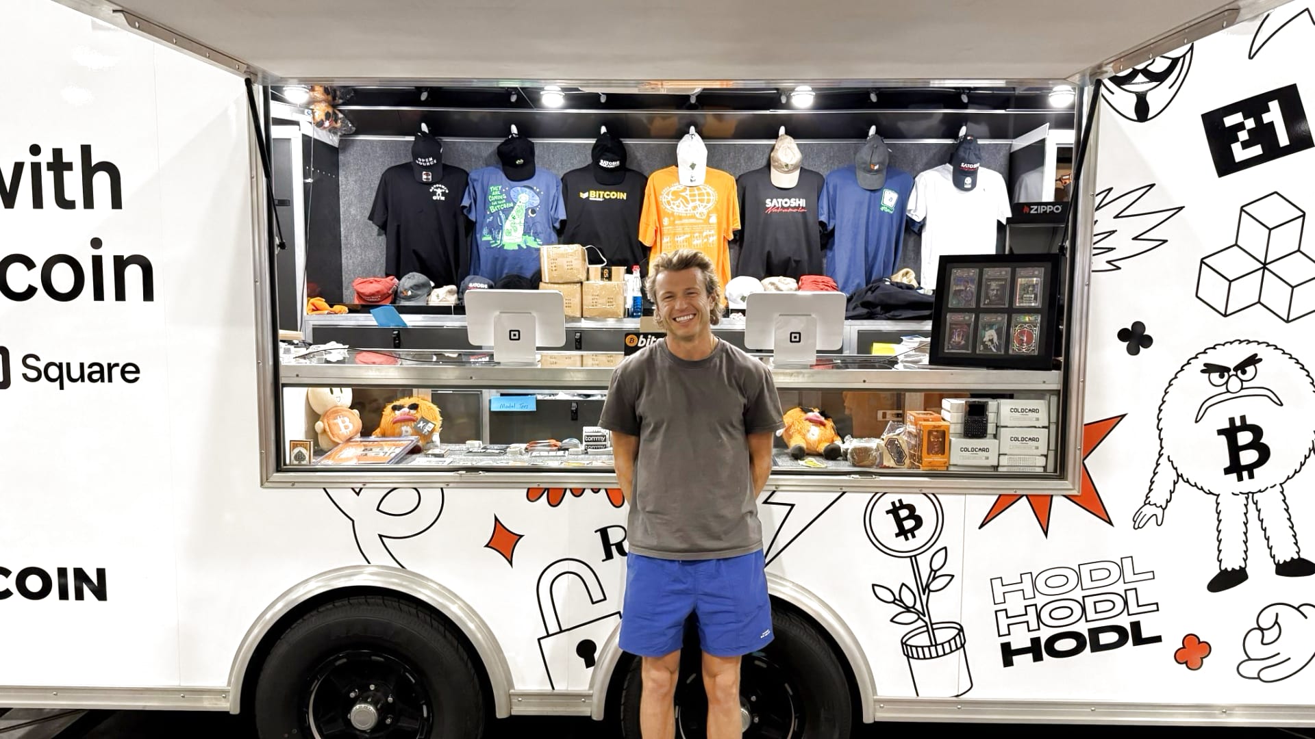 FintechKristen's tweet card. Square is piloting real-time bitcoin payments at Bitcoin 2025, letting people scan and spend crypto for T-shirts, hoodies, and hats.