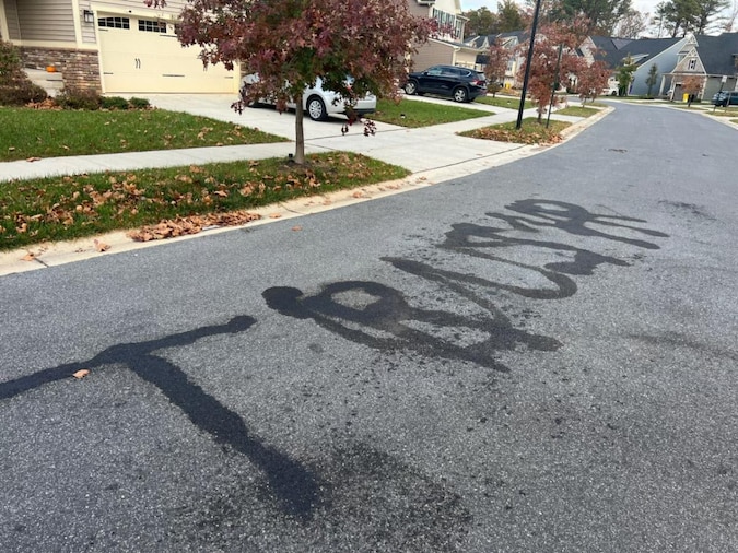 BaltimoreBanner's tweet card. The 36-year-old burned “TRUMP” and “USA” into the asphalt of Hickory Hollow Drive, where he lived.