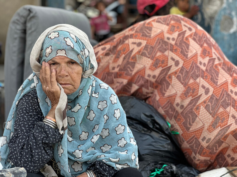 ruwaidaamer8's tweet card. Heavy shelling is replaced by a different kind of suffering: survival away from home.