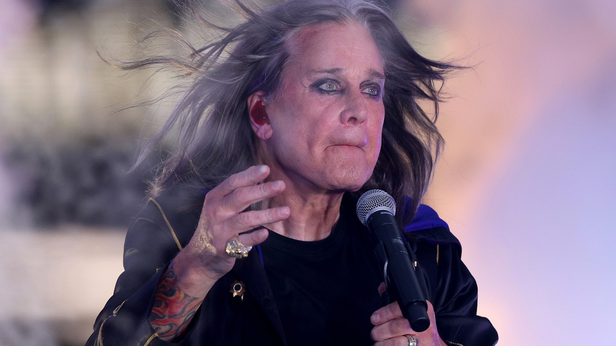 TooFab's tweet card. Remembering Ozzy Osbourne -- Photos Through the Years