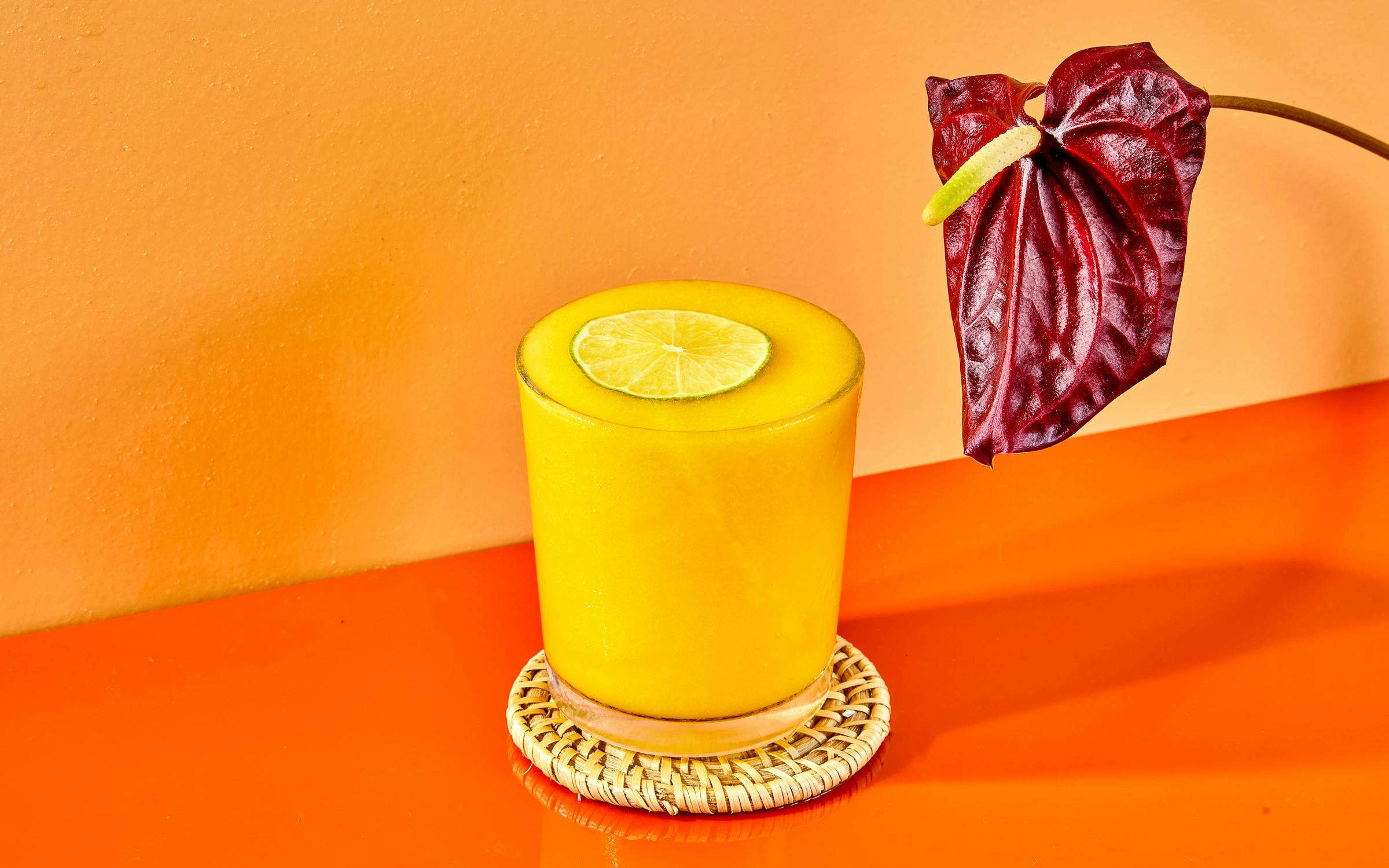 TexasMonthly's tweet card. Three types of fresh citrus juice add tang to sweet mango in this frozen cocktail.