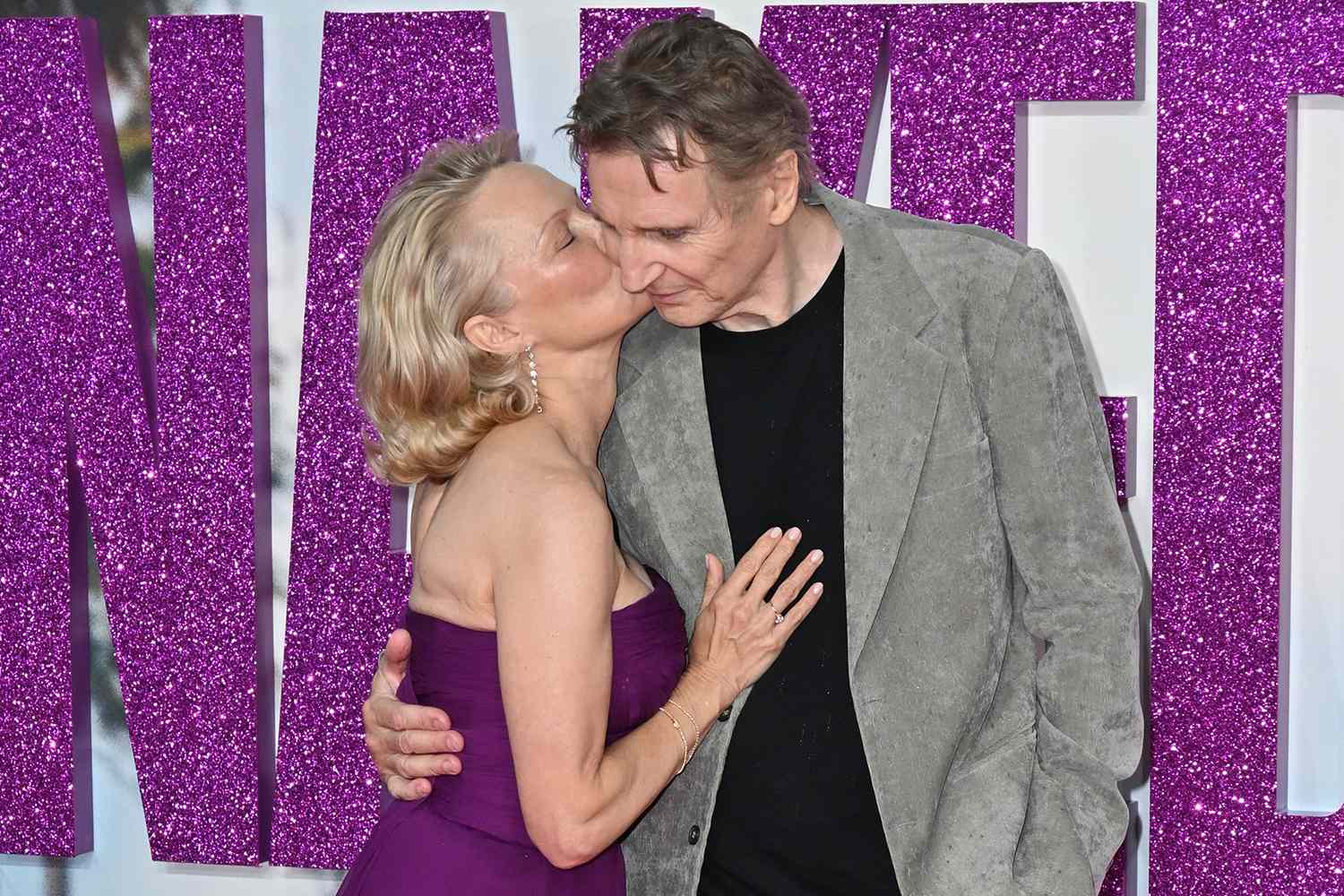 people's tweet card. Pamela Anderson gets into character with her 'Naked Gun' costar Liam Neeson at the film's U.K. premiere at Cineworld Leicester Square in London, England, on Tuesday, July 22.
