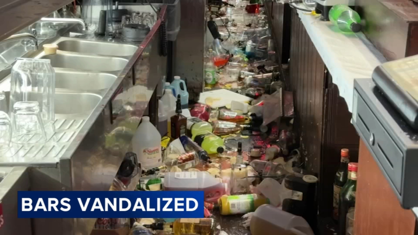 6abc's tweet card. The video shows the suspect hurl the register, throw decades-old liquor bottles and food on the floor, and shatter the mirrors behind the bar.