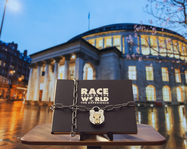 AboutMcr's tweet card. Set to open in Summer 2025,  the ticket release for Race Across The World: The Experience Manchester - the playable experience inspired by the hit BBC TV