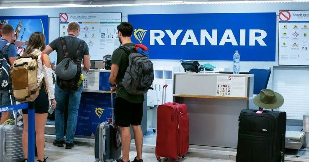 BelfastLive's tweet card. A female Ryanair passenger was left on her knees sobbing and screaming after she was stopped from boarding her flight because her hand luggage was too big