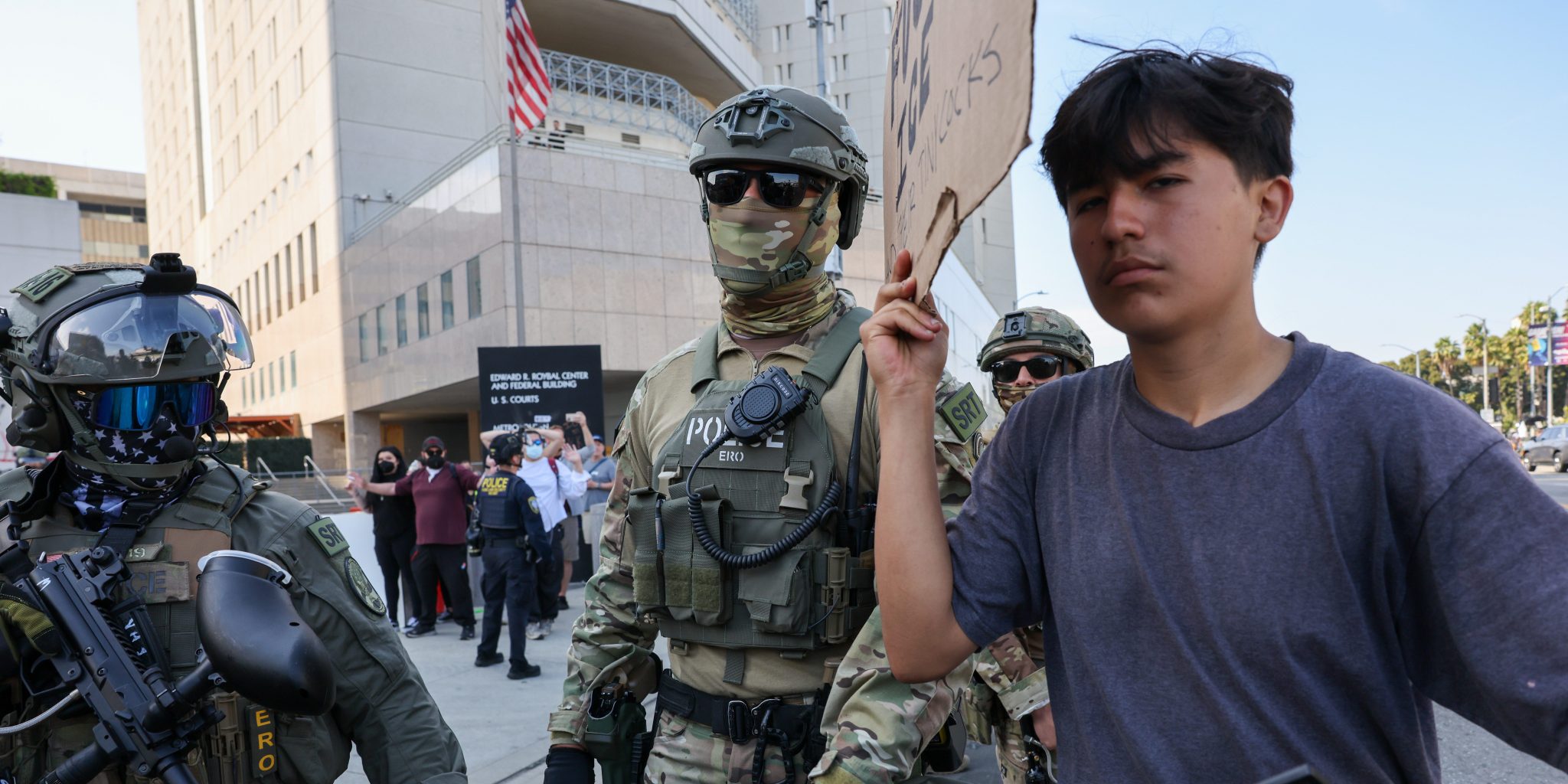 akela_lacy's tweet card. The Trump administration is targeting nonviolent acts like identifying masked agents and aiding LA’s anti-ICE protests.