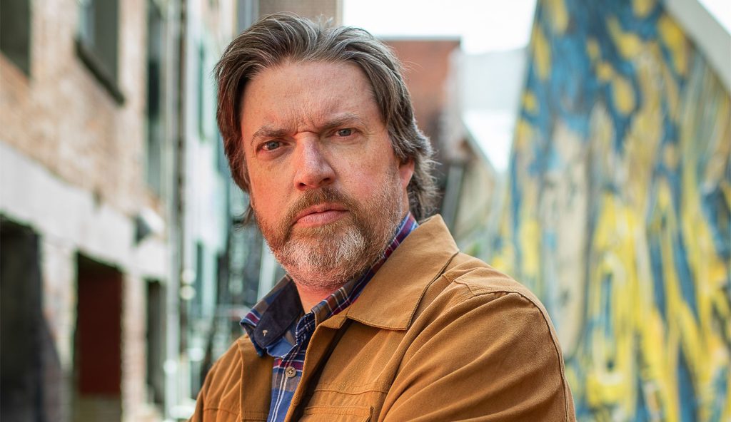 LiamMcIlvanney's tweet card. When Liam McIlvanney’s face appears on screen at precisely 10pm, he looks bright, fresh, and ready for a new day, which makes perfect sense – he’s just finished his morning coffee.