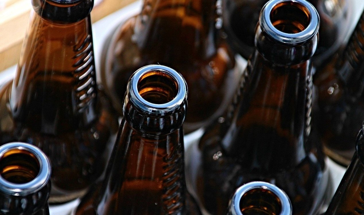 unexplainedmys's tweet card. The man had seemingly fallen on hard times and was eventually found surrounded by empty beer bottles.