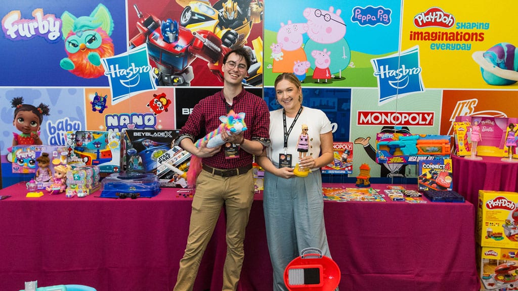 ToyBook's tweet card. In Q2, Magic: The Gathering soared 23% while Consumer Products fell 16%, highlighting the divide as Hasbro reshapes its portfolio.