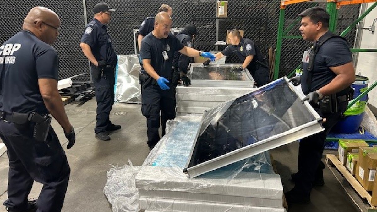 nbcsandiego's tweet card. Photos posted on social media Monday show officers cutting back the panels, revealing about 300 lbs of the illegal drug hidden underneath.