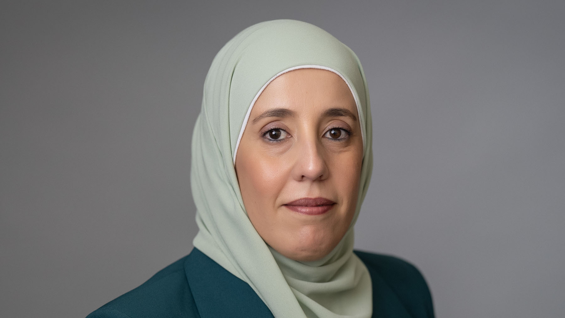 UMassD's tweet card. Nurse science educator PhD alumna reflects on her journey from obstetric nurse in Jordan to UMassD doctoral graduate