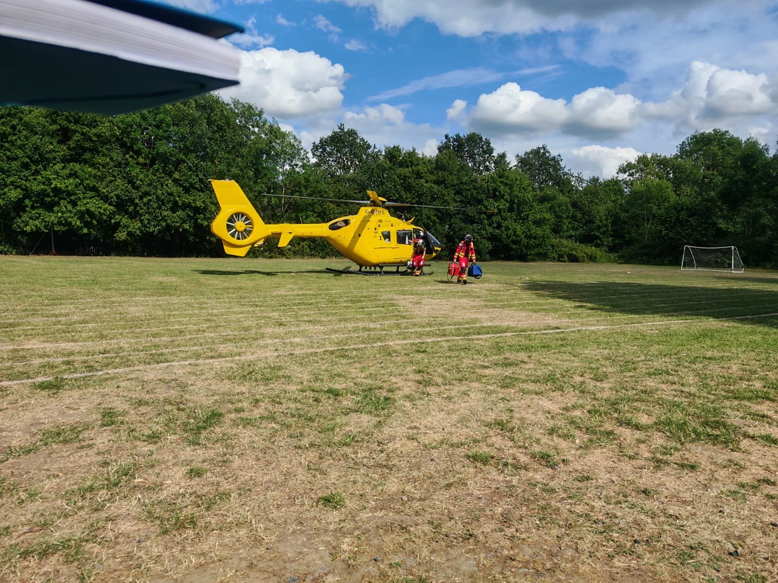 JamesConnell8's tweet card. The Midlands Air Ambulance landed in the field of Red Hill C of E Primary School in Worcester as the yellow helicopter was spotted over the city