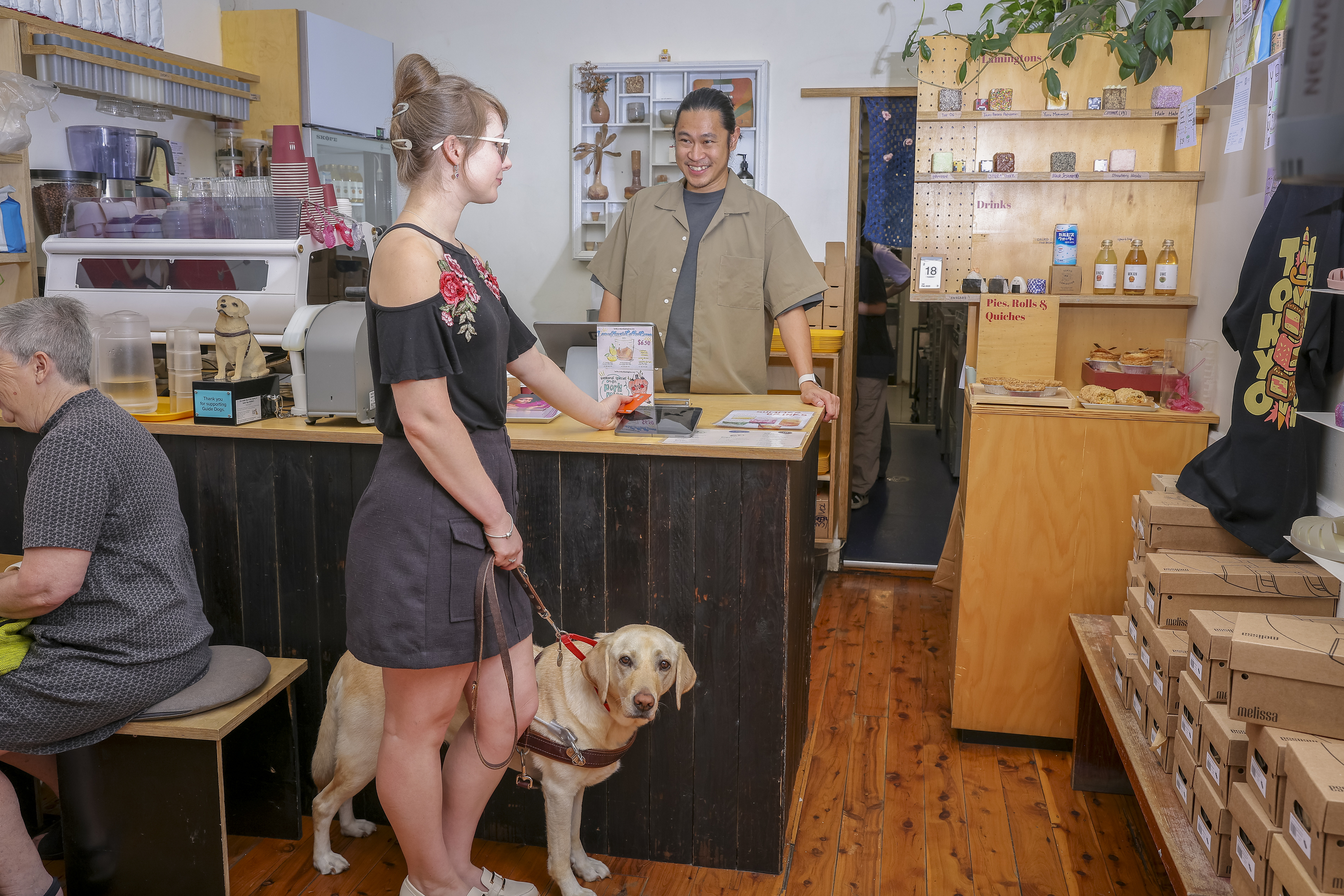 BlindNewWorld's tweet card. Newtown café Tokyo Lamington is setting an example for other businesses to make their venues inclusive for people with low vision and blindness.