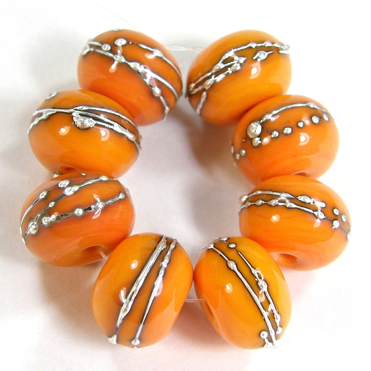 hvaradhan's tweet card. Pastel yellow handmade lampwork glass beads wrapped in fine silver with a shiny bead finish. Two (2) handmade lampwork beads Pastel yellow .999 Fine silver Shiny bead finish Measures: app 10-11mm...
