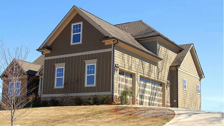 RoofContr's tweet card. U.S. asphalt shingle shipments fell 4.3% in Q2 2025 while Canada surged 24% year-to-date, revealing divergent North American roofing markets amid construction challenges.