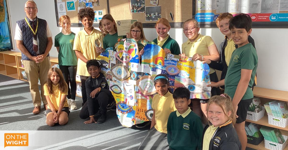 onthewight's tweet card. Pupils unite to create award-winning artwork that celebrates their hometown perspectives