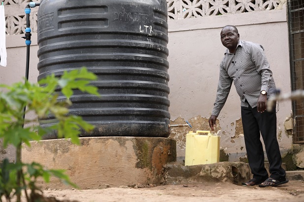 BusinessFocusug's tweet card. Pius Odongo showcasing the rainwater harvesting tank he installed for his rental houses in Mukono after getting a loan through the Housing Finance Bank’s Water supply and Sanitation financing...