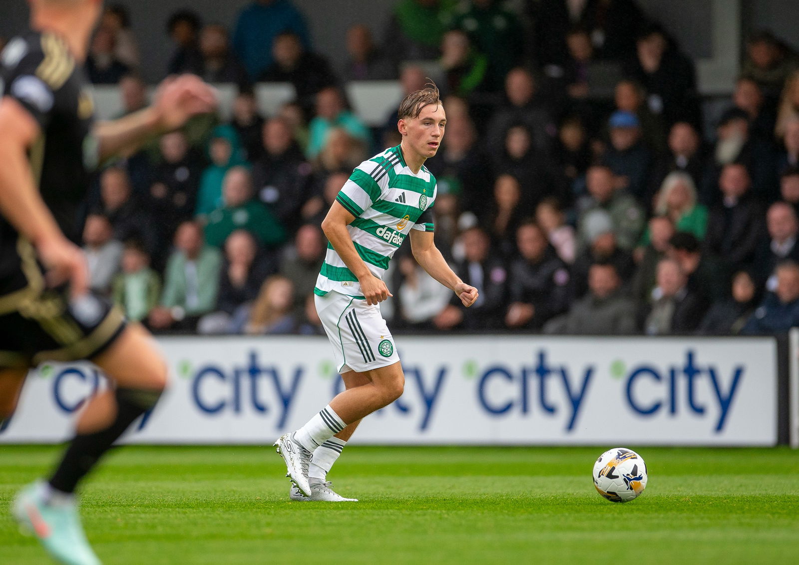 CeltsAreHere's tweet card. Adam Montgomery has opened up on his decision to leave Celtic on loan once again, revealing the return of Kieran Tierney made his first-team chances even more