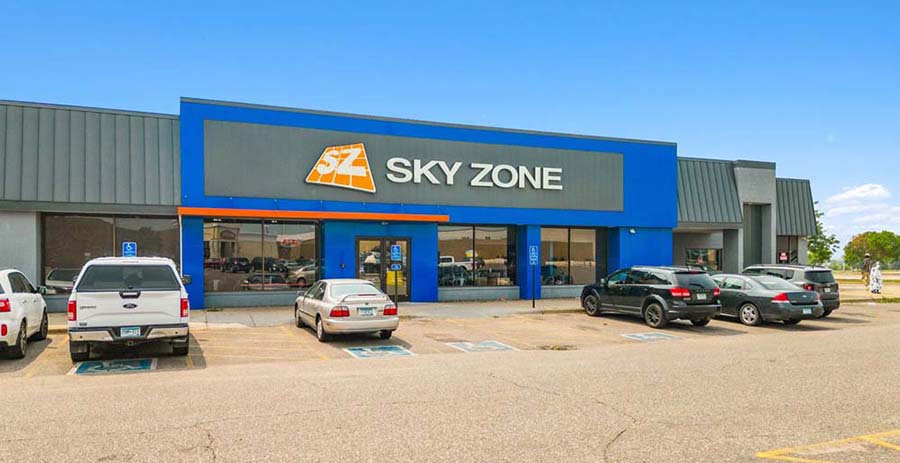 BusinessMN's tweet card. Sky Zone Blaine is listed for $3.56M, while 16 acres of West Side Flats land offer mixed-use potential near downtown St. Paul and the Mississippi River.