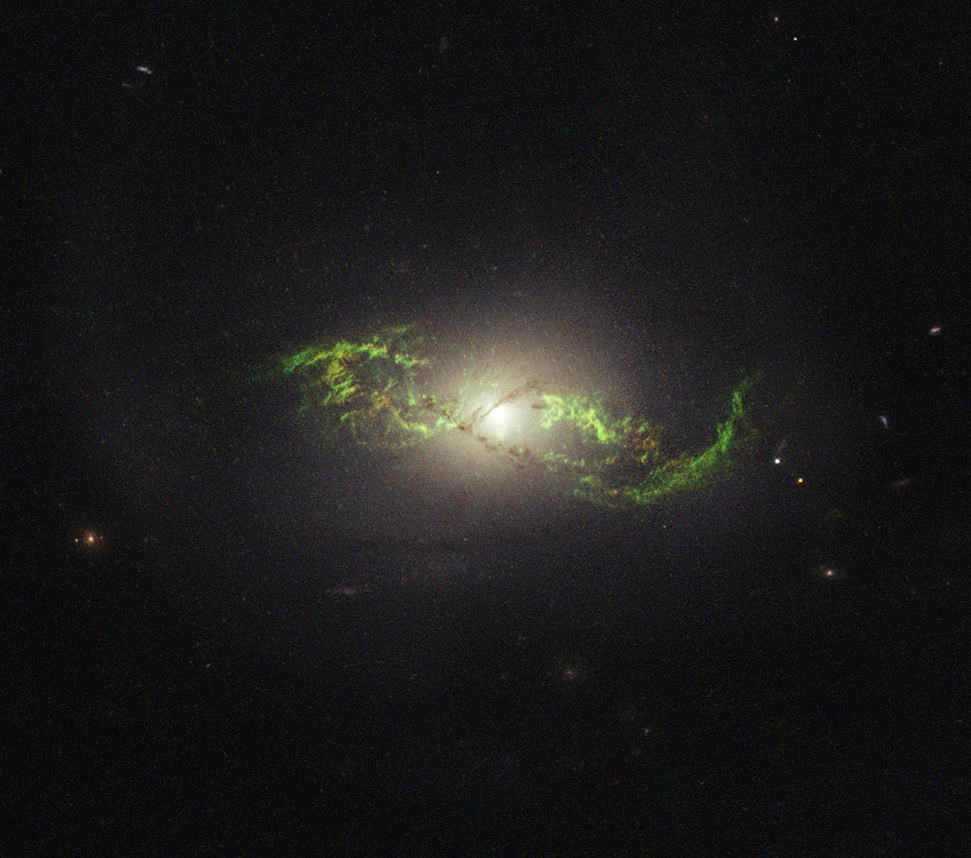 AASNova's tweet card. Astrobites reports on the origins of the unusual green structure surrounding the active galaxy NGC 5972.