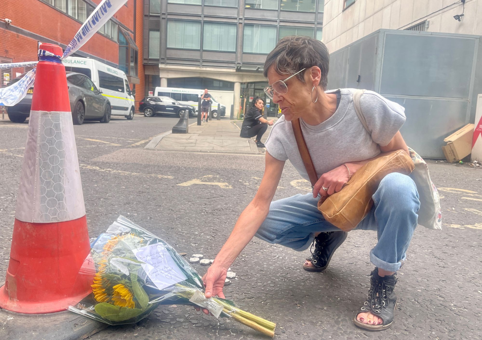 NewJournal's tweet card. Flowers left to 'Rachel' as police confirm death of woman in her 40s