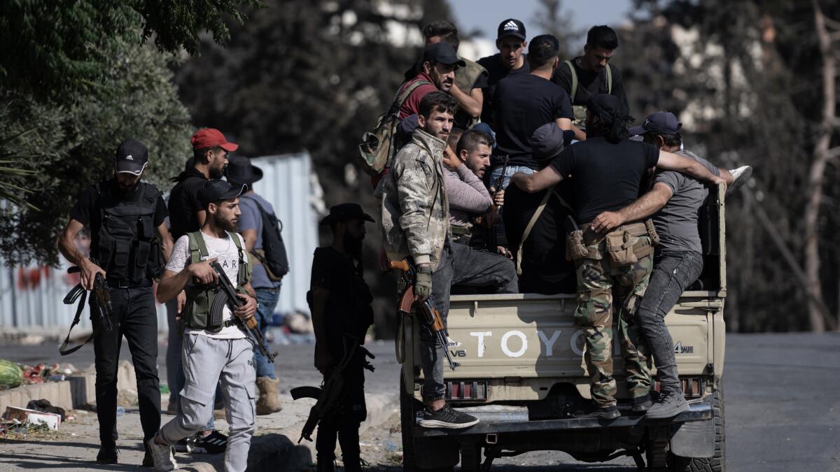 therealgregjack's tweet card. Sectarian violence has turned a Syrian city into a slaughterhouse, and survivors recount shelling, executions and burials in a mass grave.