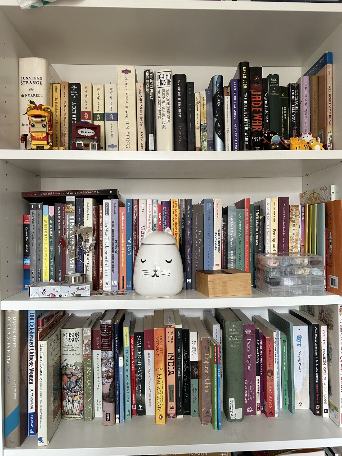 lavietidhar's tweet card. My “to be read” pile is literally a teetering pile on top of another bookcase, too messy to be shown off