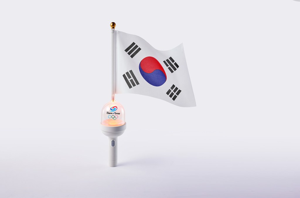 HYBEOFFICIALtwt's tweet card. Prized K-pop merchandise light sticks will be seen at the Olympics Opening Ceremony in Paris, created by HYBE for Team South Korea.