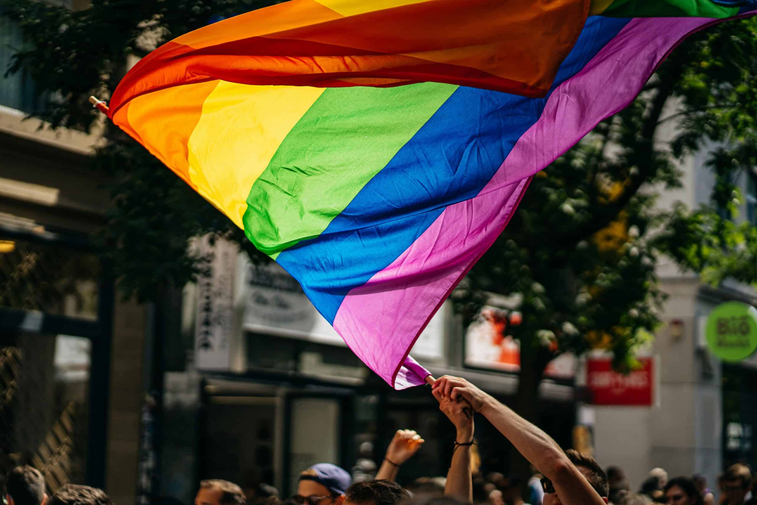 ABCTAutism's tweet card. Tips and strategies for autistic people to navigate Pride events, offering ways to manage sensory challenges and enjoy the celebration.