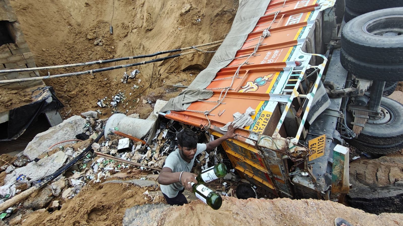 mallicajoshi's tweet card. Since Wednesday night, workers from a nearby wholesale liquor godown have been hard at work, removing beer bottles from 1,500 crates after the truck fell into a crater on Southern Peripheral Road....