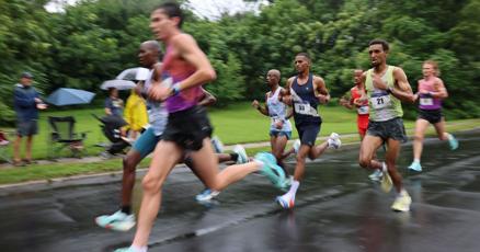 qctimes's tweet card. Runners and walkers moved through a rainy Kirkwood Boulevard during the 51st running of the Quad-City Times Bix 7 on Saturday, July 26.